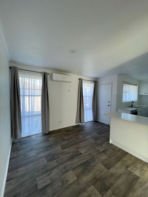 Modern Comfort and Easy Living with Gardener Included - Photo 1