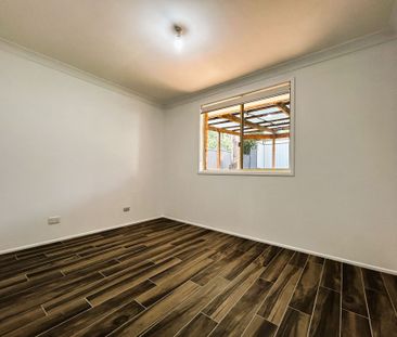 Stylish Renovated Home Offering Comfort, Space & Convenience - Photo 2