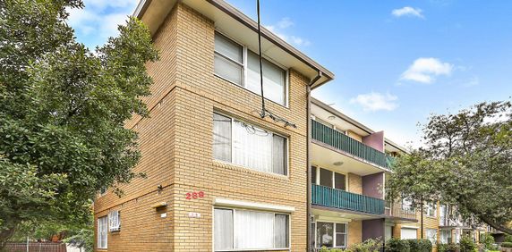 GROUND FLOOR TWO BEDROOM APARTMENT WITH BALCONY AND LOCK UP GARAGE - Photo 2