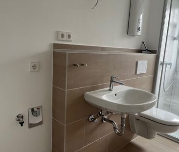 Top modernisiert: Wohnen in begehrter Erdgeschosslage mit 2 Balkonen - Foto 4