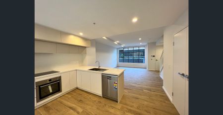 Near new, split level, spacious two bedroom, two bathroom apartment in quiet location only metres from Homebush Train Station - Photo 3