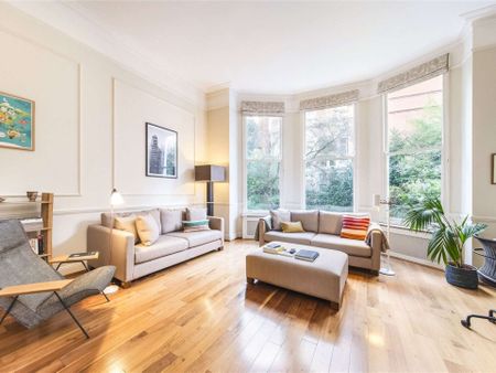 A fantastic two bedroom flat on the ground floor of this well maintained building benefiting from high ceilings and an abundance of natural light. - Photo 3