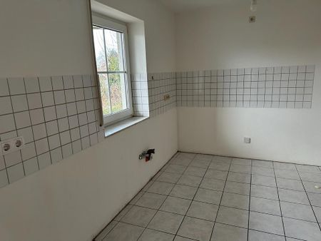 Souterrain-Wohnung mit Terrasse - Foto 3