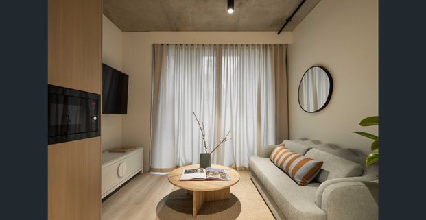 One-bedroom with study in a prime location with gym, pool, spa, sauna & co-working - Photo 1