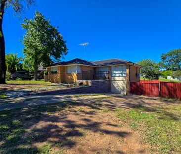 Spacious Family Home with Drive-Through Parking & Outdoor Entertaining - Photo 1