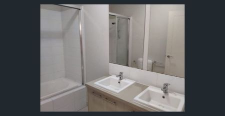 Modern Three-Bedroom Townhouse with Stylish Living in Prime North Melbourne Location - Photo 4