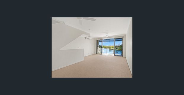 STUNNING WATERFRONT TOWNHOUSE IN EMERALD LAKES - Photo 1