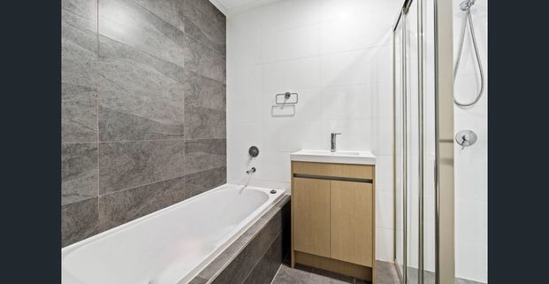 Modern Three Bedroom Living in an Unbeatable Location! - Photo 1