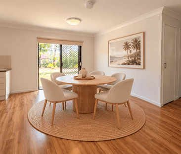 Charming Three-Bedroom Home with Spacious Yard & Side Access! - Photo 2