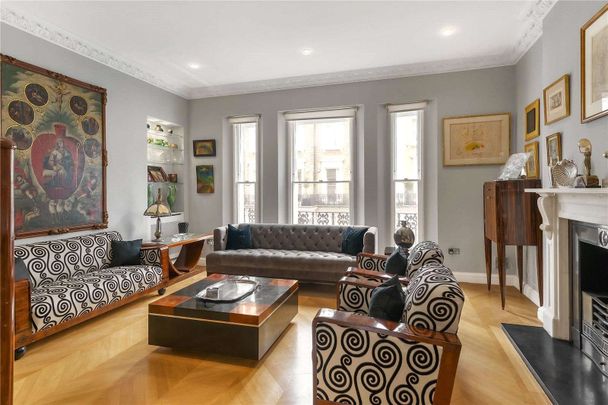 A 'key' Grade II listed part stucco fronted house, located just off Onslow Gardens. - Photo 1