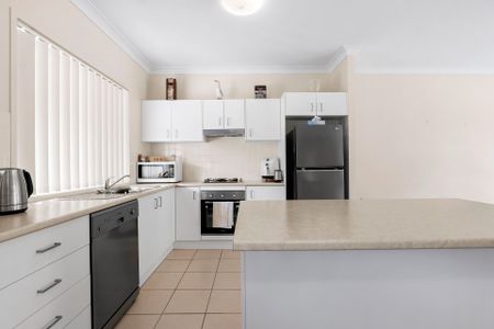 Nestled in a peaceful complex, this delightful two-bedroom unit offers comfort and convenience - Photo 4