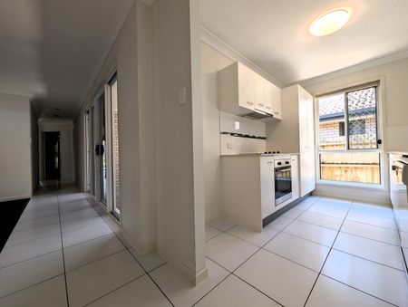 Private Oasis Backing Onto Bushland – Spacious Family Living in Prime Location - Photo 5