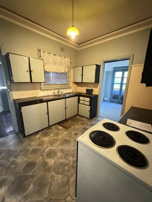 Spacious 2-Bedroom Home with Sunroom & Large Backyard � Prime Location! - Photo 1