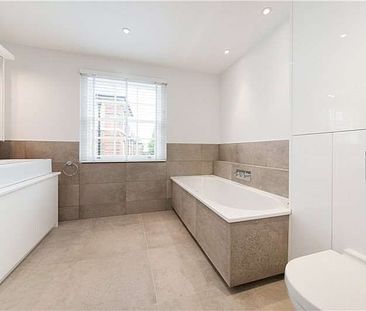 This four bedroom townhouse is tucked away on a quiet street moments from the amenities of the Kings Road. - Photo 4