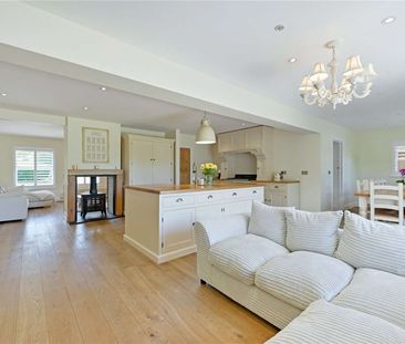 A beautifully refurbished four-bedroom family home featuring versat... - Photo 3