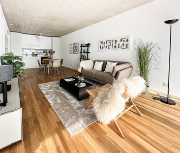 Moderne Leichtigkeit: 2.5-Zimmer-Wohnung im architektonischen Riegel - Foto 1