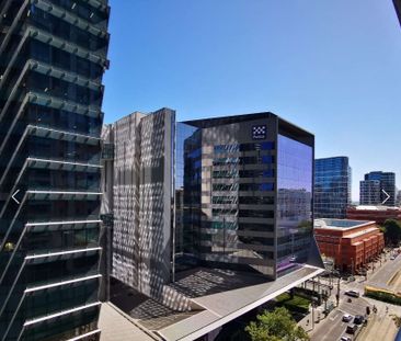 Furnished CBD Gem with Spectacular Views at 1204/480 Spencer Street! - Photo 1