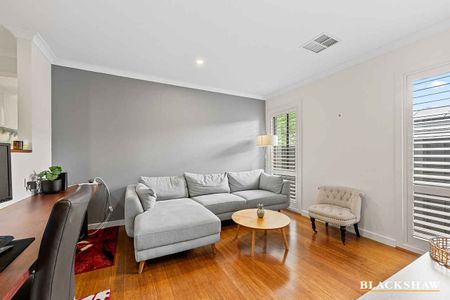 Welcoming Family Home with Open Living Spaces and Home Office - Photo 2