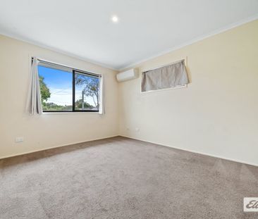 Spacious Family Home with Modern Amenities and Ample Outdoor Space - Photo 1