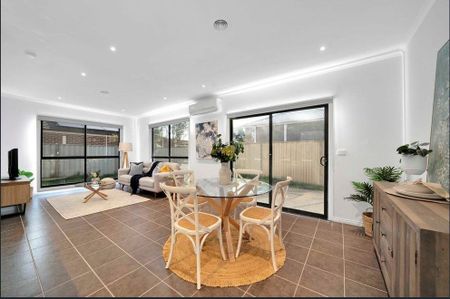 Spacious Four-Bedroom Residence with Two Bathrooms & Secure Garage - Photo 2