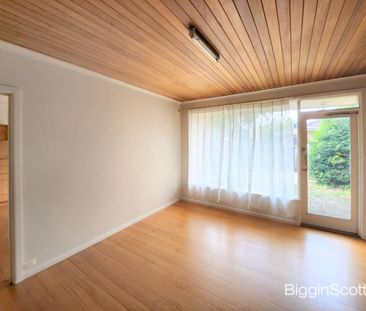 Cozy Three-Bedroom Home with Modern Amenities and Convenient Location - Photo 1