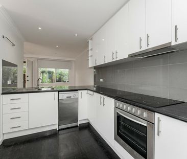 RENOVATED TWO BEDROOM UNIT WITH EXPANSE OF OUTDOOR SPACE - Photo 3