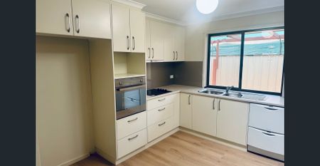 Spacious Family Living with Huge Shed & Renovated Kitchen - Photo 2