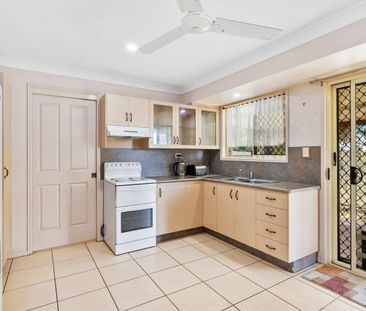 Comfortable Low-Set Brick Home - Photo 1