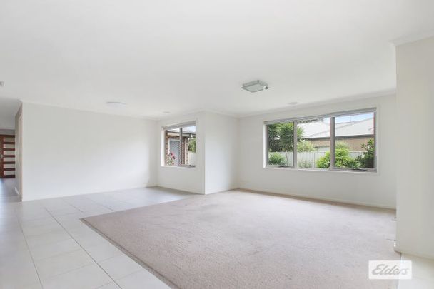 Spacious 4-Bedroom Family Home with Modern Comforts and Solar Power - Photo 1