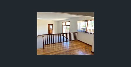 Double storey home with multiple living spaces - Photo 4