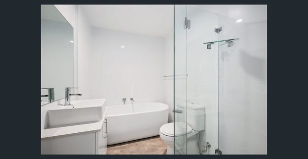 Refined North‑East Corner Apartment Offering Exceptional Village‑Side Living - Photo 1