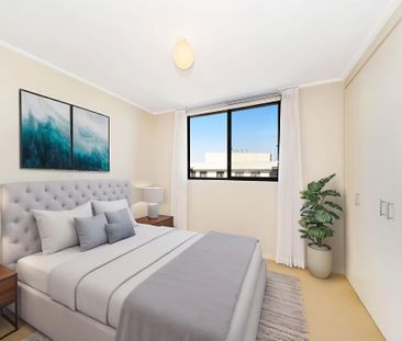 Spacious Top Floor Apartment with Sweeping Views - Photo 6