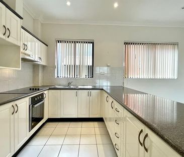 Sun-Filled and Spacious Apartment with Secure Undercover Parking - Photo 1