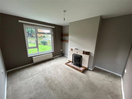 A three-bedroom semi-detached cottage located in the village of Llangedwyn. - Photo 1