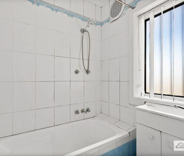 Neat & Tidy Family Home | Split-Level Living in Prime Location - Photo 4