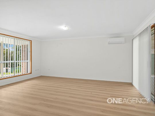 SPACIOUS THREE-BEDROOM HOME WITH LARGE ENTERTAINING AREA AND CLOSE TO THE WATER - Photo 1