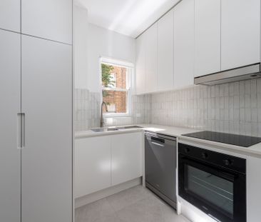 Stylishly Renovated 2-Bedroom Unit with Lock-Up Garage - Photo 5