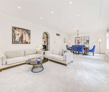 A stunning lateral apartment situated in a desirable red brick Kensington mansion block. - Photo 1