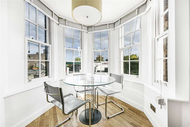 A modern two bedroom apartment set on the first floor of a residential building in Golders Green. - Photo 1