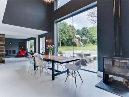 A truly impressive family home in a popular residential road in Esher, offering stylish and modern living with 5 bedrooms, 3 bathrooms and 4 reception areas. - Photo 4