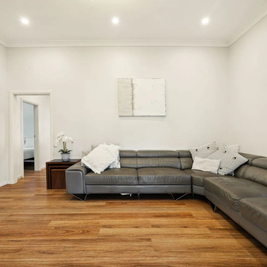 Stylishly updated north-to-rear facing home set on a tree-lined street - Photo 1