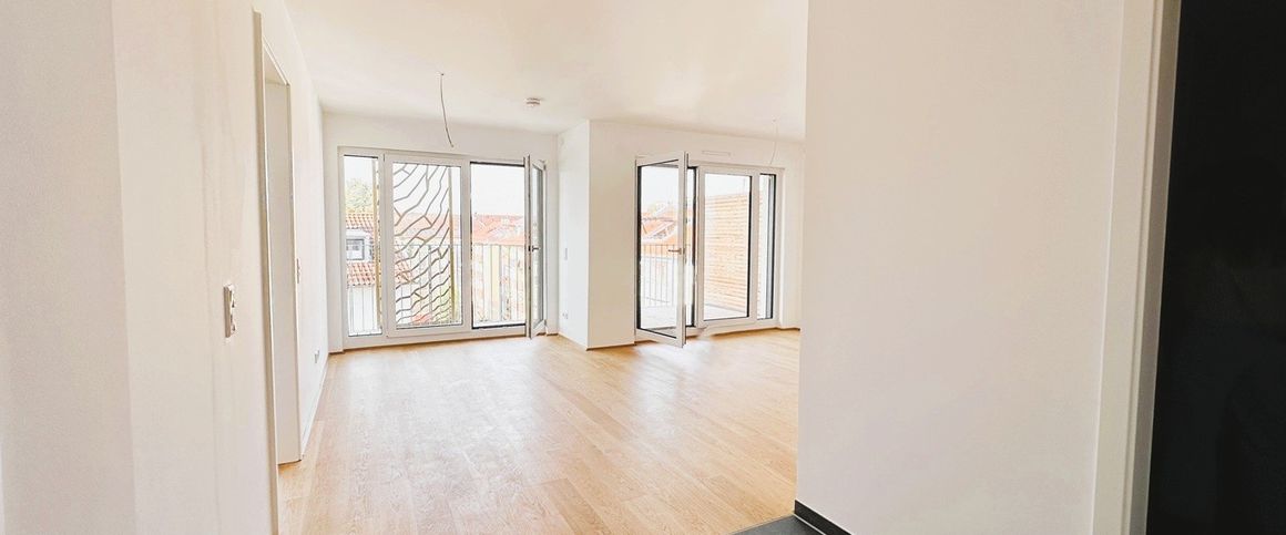 Ganz fein & funkelnagelneu: mit sonniger Dachterrasse und Einbauküche! - Foto 1