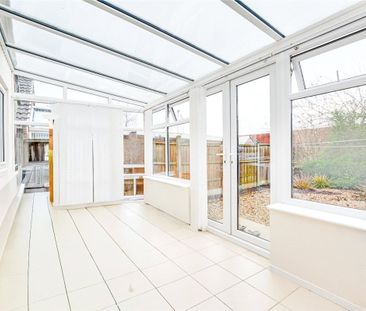 A 2 bedroom detached bungalow with a garage and driveway parking in... - Photo 2