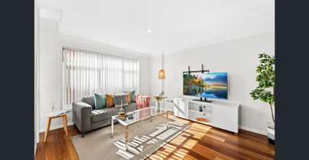 Light Filled Apartment with Oversized Lockup Garage - Photo 2