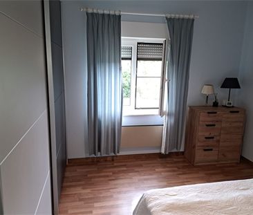 Een appartement op de eerste verdieping met garage en tuintje - Foto 4