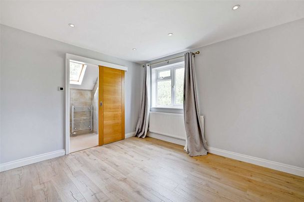 This beautifully refurbished 5/6-bedroom detached home is set in a quiet spot with stunning Chiltern Hills views, offering spacious, light-filled accommodation finished to a high standard. - Photo 1