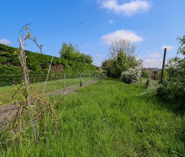Leuke rijwoning met zij-ingang naar grote tuin - Photo 1