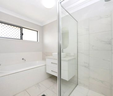 Spacious 4-Bedroom Home with Modern Comforts - Photo 1