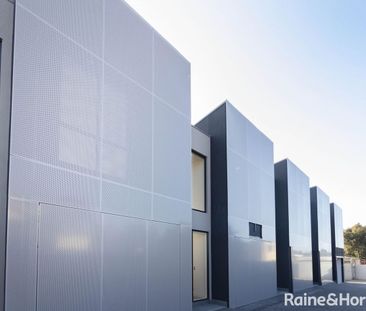 NEWLY BUILT! ARCHITECTURAL TOWNHOUSE IN BRUNSWICK AWAITS YOU - Photo 1