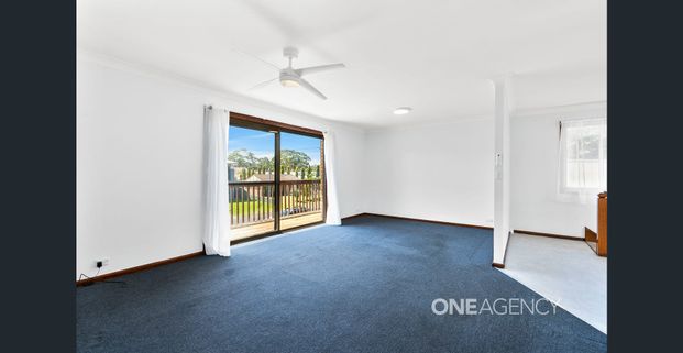 CHARMING COASTAL RETREAT IN CALLALA BEACH - Photo 1